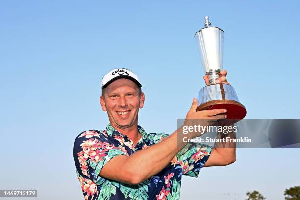 Marcel Siem of Germany poses with the Hero Indian Open trophy after winning the Hero Indian Open at Dlf Golf and Country Club on February 26, 2023 in...