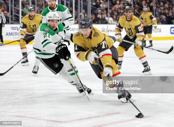 William Karlsson of the Vegas Golden Knights skates with the puck against Jason Robertson of the Dallas Stars in the second period of their game at...