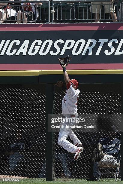 Alex Rios of the Chicago White Sox leaps to make a catch to rob Corey Hart of the Milwaukee Brewers of a home run during an interleague game at U.S....