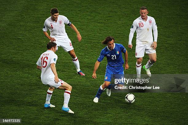 Andrea Pirlo of Italy runs with ball as James Milner, Steven Gerrard and Wayne Rooney look on of Englandduring the UEFA EURO 2012 quarter final match...