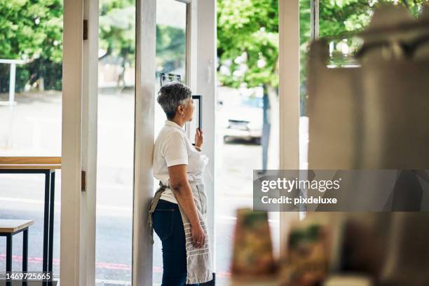 sad, lonely and senior woman small business owner thinking in store or shop worried and contemplating. fail, unhappy and elderly entrepreneur with startup issues with anxiety, problem and stress - overworked waitress stock pictures, royalty-free photos & images