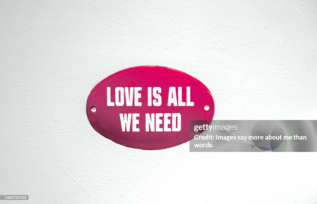 A simple red sign gives an optimistic thought.