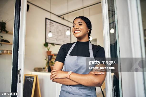 happy, smile and open with black woman in coffee shop for small business owner, retail and management. bakery, restaurant and cafe with girl employee at door for welcome, waitress and  empowerment - bakning business bildbanksfoton och bilder