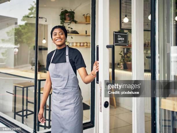 looking, opening and black woman at a coffee shop door for business, welcome and hospitality. entrance, service and african server at a cafe to open the restaurant, store or diner in the morning - store reopening stock pictures, royalty-free photos & images