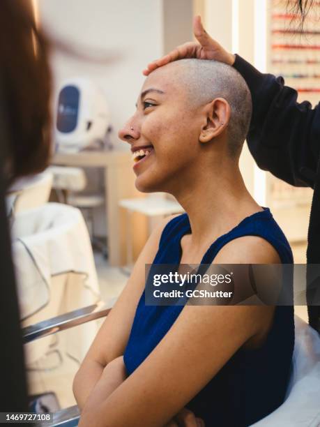 girl donating hair to a cancer charity foundation - world kindness day stock pictures, royalty-free photos & images