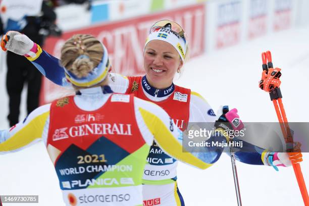 Gold medalists, Emma Ribom and Jonna Sundling of Team Sweden embrace following the Women's Final in the Cross-Country Team Sprint at the FIS Nordic...