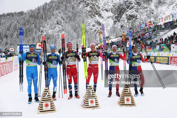 Silver medalists, Francesco De Fabiani and Federico Pellegrino of Team Italy, gold medalists, Paal Golberg and Johannes Hoesflot Klaebo of Team...