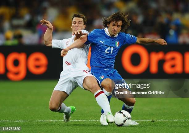 Scott Parker of England and Andrea Pirlo of Italy challenge for the ball during the UEFA EURO 2012 quarter final match between England and Italy at...