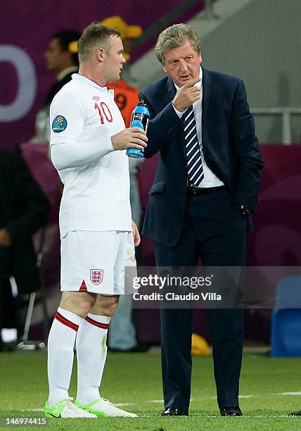 England manager, Roy Hodgson speaks with Wayne Rooney during the UEFA EURO 2012 quarter final match between England and Italy at The Olympic Stadium...