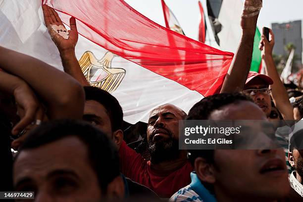 Egyptians celebrate the election of their new president Mohamed Morsi in Tahrir Square on June 24, 2012 in Cairo, Egypt. Official election results...