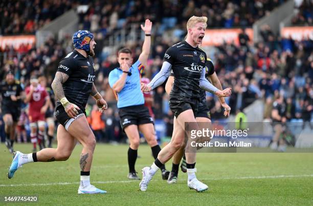 Josh Hodge of Exeter Chiefs celebrates after diving over to score his side's third try during the Gallagher Premiership Rugby match between Exeter...