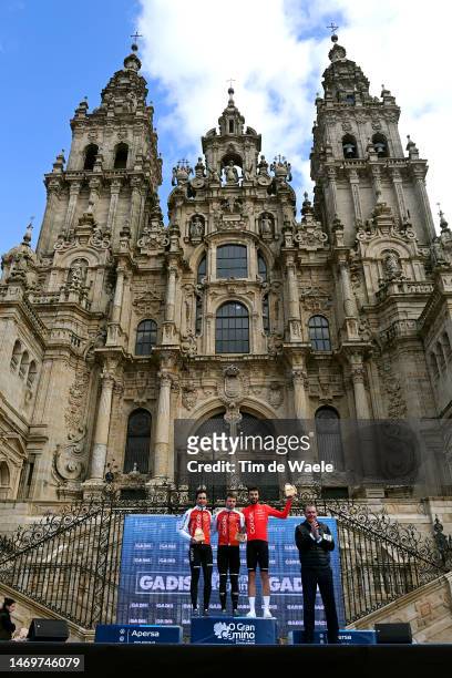 José Herrada of Spain, Jonathan Lastra of Spain and Jesús Herrada of Spain and Team Cofidis celebrate at podium as best team winners with the front...