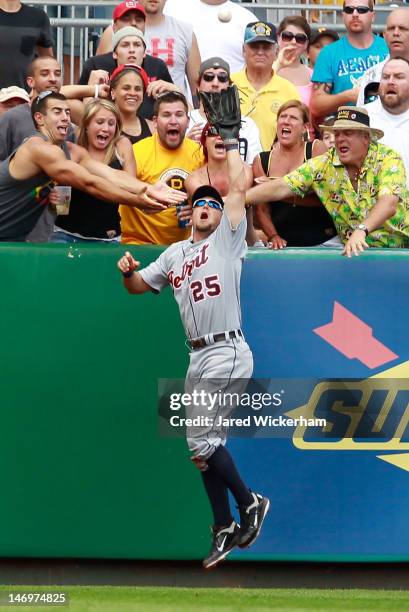 Ryan Raburn of the Detroit Tigers saves a home run by catching a fly ball in the 8th inning at the wall against the Pittsburgh Pirates during the...