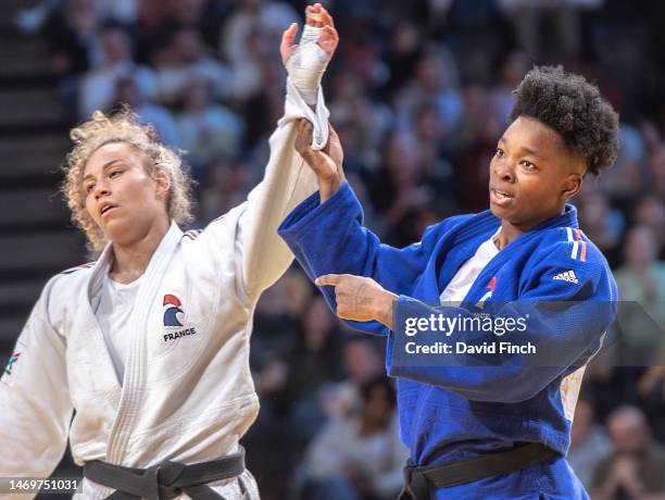 Audrey Tcheumeo of France sportingly lifts the arm of her defeated French opponent, Chloe Buttigieg after winning the u78kg final and gold medal...