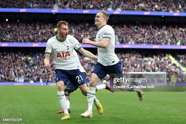 Oliver Skipp of Tottenham Hotspur celebrates with teammate Dejan Kulusevski after scoring the team's first goal during the Premier League match...