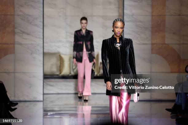 Models walk the runway at the Giorgio Armani fashion show during the Milan Fashion Week Womenswear Fall/Winter 2023/2024 on February 26, 2023 in...