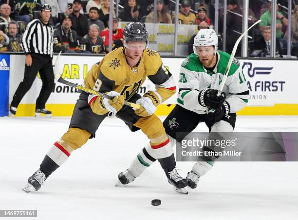 Jack Eichel of the Vegas Golden Knights skates with the puck against Joe Pavelski of the Dallas Stars in overtime of their game at T-Mobile Arena on...