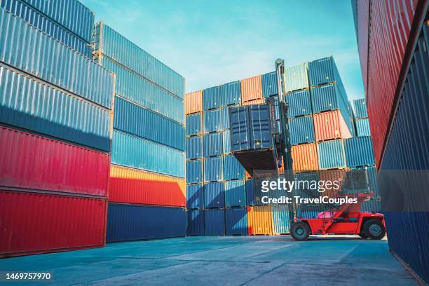 foreman control loading containers box from cargo freight ship for import export. - containers harbour stock pictures, royalty-free photos & images