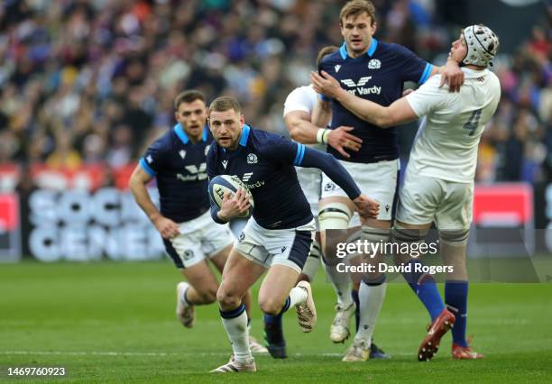 Finn Russell of Scotland breaks with the ball during the Six Nations Rugby match between France and Scotland at Stade de France on February 26, 2023...