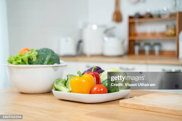 fresh vegetables prepared for cooking vegetables salad. - worktop imagens e fotografias de stock