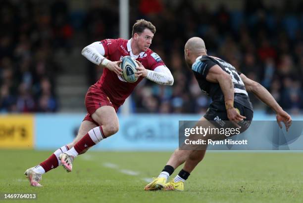 Tom Roebuck of Sale Sharks runs with the ball whilst under pressure from Olly Woodburn of Exeter Chiefs during the Gallagher Premiership Rugby match...