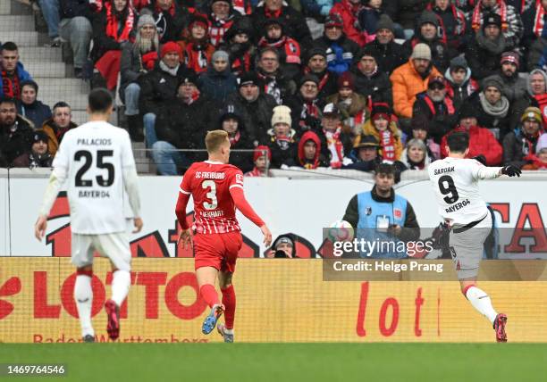 Sardar Azmoun of Bayer 04 Leverkusen scores the team's first goal during the Bundesliga match between Sport-Club Freiburg and Bayer 04 Leverkusen at...