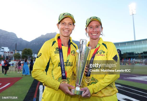 Meg Lanning and Beth Mooney of Australia lift the ICC Women's T20 World Cup following the ICC Women's T20 World Cup Final match between Australia and...