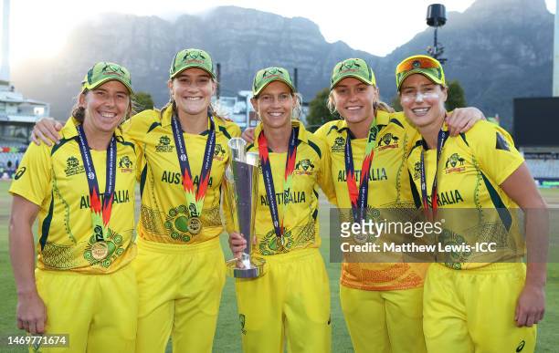 Georgia Wareham, Annabel Sutherland, Meg Lanning, Kim Garth and Ellyse Perry of Australia pose the ICC Women's T20 World Cup following the ICC...