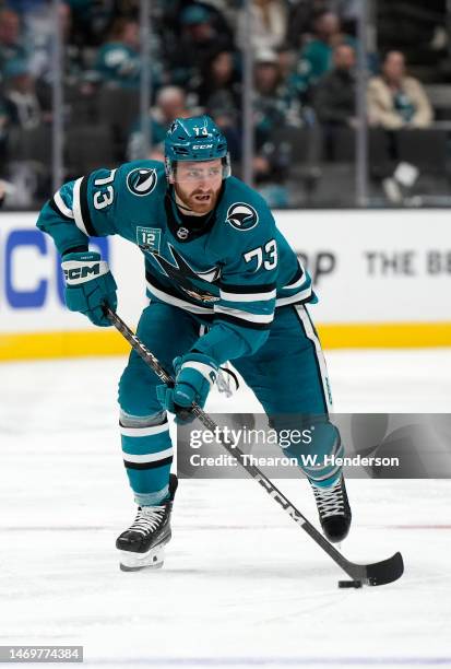 Noah Gregor of the San Jose Sharks skates with the puck against the Chicago Blackhawks during the second period at SAP Center on February 25, 2023 in...