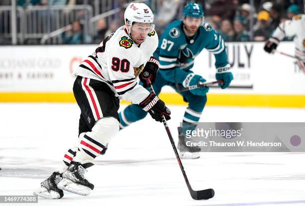 Tyler Johnson of the Chicago Blackhawks skates with the puck against the San Jose Sharks during the third period at SAP Center on February 25, 2023...