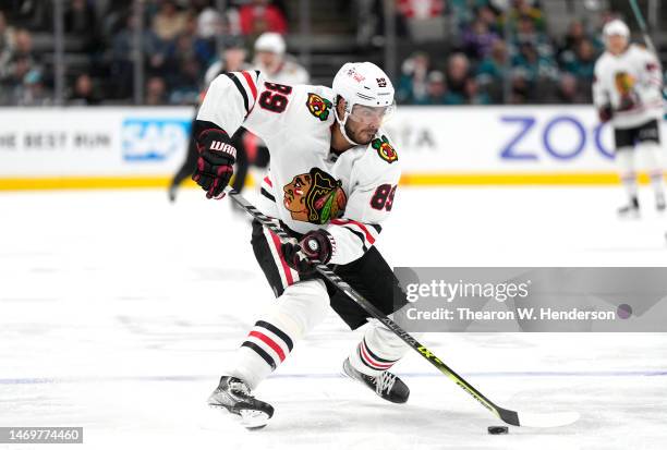 Andreas Athanasiou of the Chicago Blackhawks skates with the puck against the San Jose Sharks during the third at SAP Center on February 25, 2023 in...