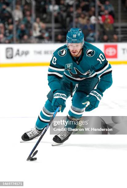 Evgeny Svechnikov of the San Jose Sharks skates with the puck against the Chicago Blackhawks during the second period at SAP Center on February 25,...