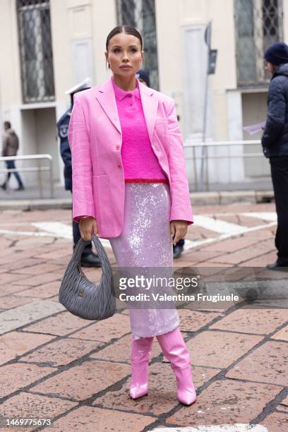 Guest is seen wearing a pink ensable outside the Giorgio Armani show during the Milan Fashion Week Womenswear Fall/Winter 2023/2024 on February 26,...