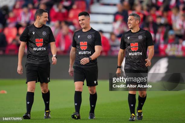Referee Ortiz Arias and assistant referees Garrido Romero and Masso Granado look on prior to the LaLiga Santander match between UD Almeria and FC...
