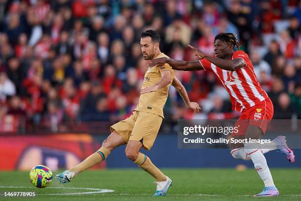 El Bilal Toure of UD Almeria competes for the ball with Sergio Busquets of FC Barcelona during the LaLiga Santander match between UD Almeria and FC...