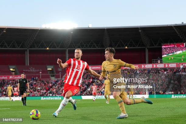 Rodrigo Ely of UD Almeria battles for possession with Gavi of FC Barcelona during the LaLiga Santander match between UD Almeria and FC Barcelona at...