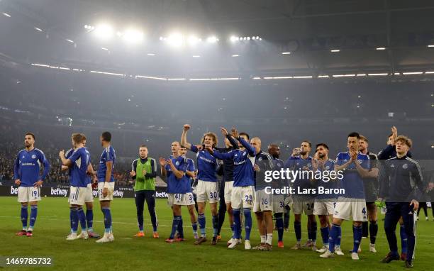 Players of Schalke celebrate with their fans after winning the Bundesliga match between FC Schalke 04 and VfB Stuttgart at Veltins-Arena on February...