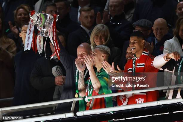 Erik ten Hag, Manager of Manchester United, lifts the Carabao Cup trophy following victory in the Carabao Cup Final match between Manchester United...