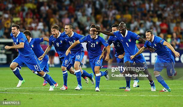 Italy players celebrate after the penalty shoot out during the UEFA EURO 2012 quarter final match between England and Italy at The Olympic Stadium on...