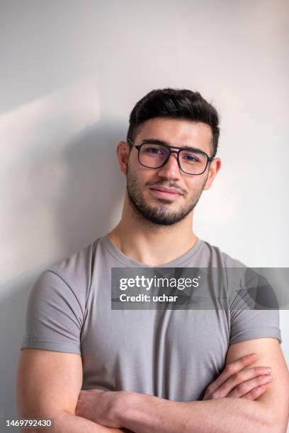 portrait of young man with glasses - monacle glasses stock pictures, royalty-free photos & images