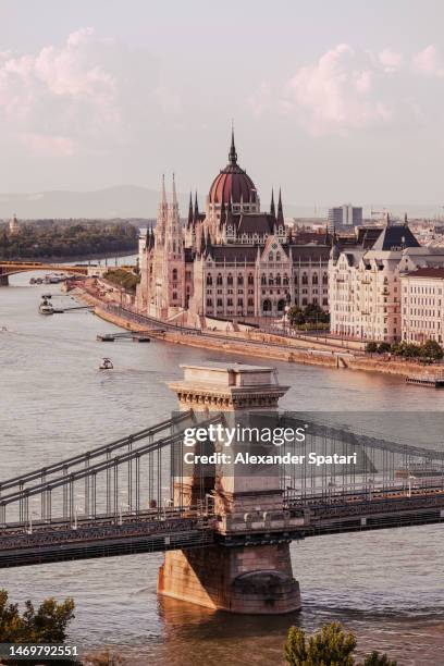 hungarian parliament building and szechenyi chain bridge, budapest, hungary - budapest bridge stock pictures, royalty-free photos & images