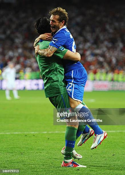 Alessandro Diamanti of Italy celebrates scoring the winning penalty with Gianluigi Buffon during the UEFA EURO 2012 quarter final match between...