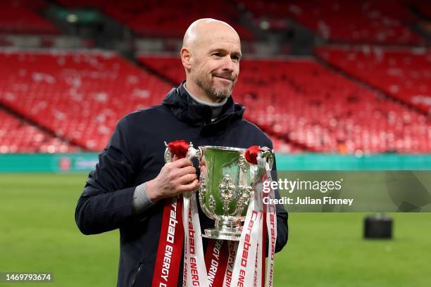 Erik ten Hag, Manager of Manchester United, celebrates with the Carabao Cup trophy following victory in the Carabao Cup Final match between...