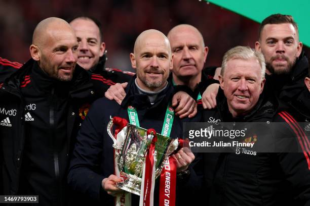 Erik ten Hag , Manager of Manchester United, Assistant Managers, Mitchell van der Gaag and Steve McClaren celebrate with the Carabao Cup trophy...