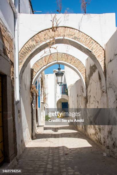 arched alleyway in tunis - tunis stock pictures, royalty-free photos & images