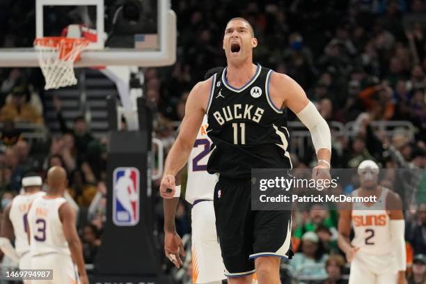 Brook Lopez of the Milwaukee Bucks celebrates after making a basket against the Phoenix Suns in the first half of the game at Fiserv Forum on...