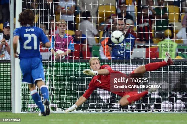 Italian midfielder Andrea Pirlo kicks and scores a penalty in the nets of English goalkeeper Joe Hart during a penalty shoot out at the Euro 2012...