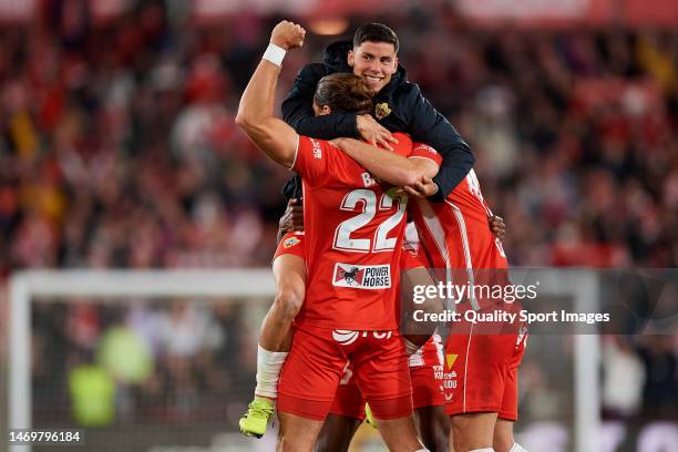 Players of UD Almeria celebrate victory after the LaLiga Santander match between UD Almeria and FC Barcelona at Power Horse Stadium on February 26,...