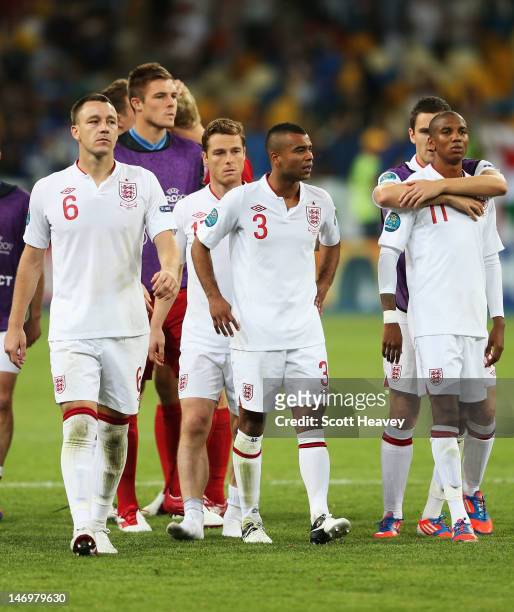 John Terry, Scott Parker, Ashley Cole and Ashley Young of England look dejected after the penalty shoot out during the UEFA EURO 2012 quarter final...