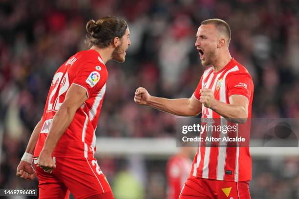 Rodrigo Ely of UD Almeria celebrates victory with teammate Srdjan Babic following the LaLiga Santander match between UD Almeria and FC Barcelona at...